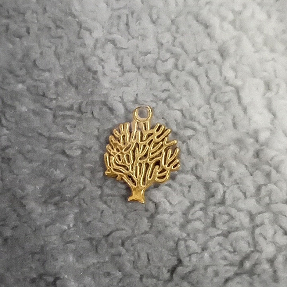 Tree pendant slight imperfection at the top of the loop